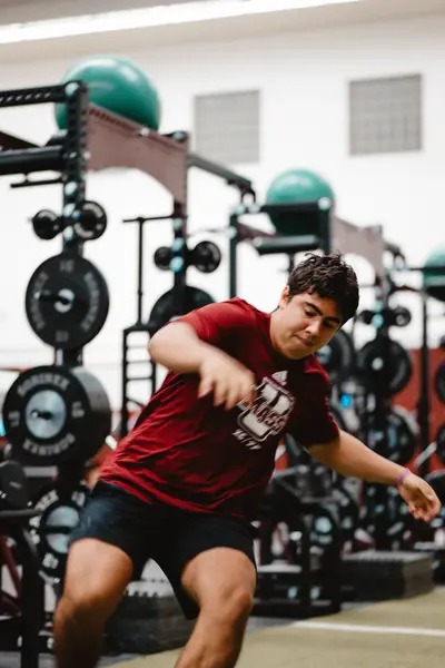 UMass Athletics strength and conditioning — athlete training in the weight room, Amherst MA