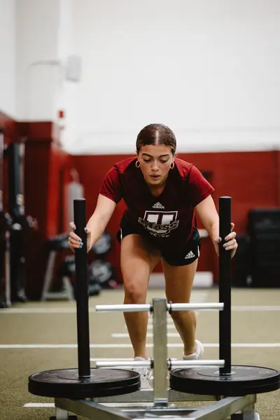 UMass Athletics strength and conditioning — athlete training in the weight room, Amherst MA