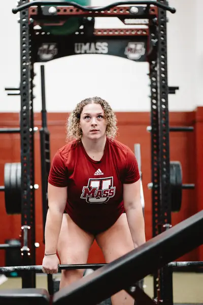 UMass Athletics strength and conditioning — athlete training in the weight room, Amherst MA